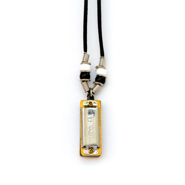 Harmonica pendant necklace with black cord.